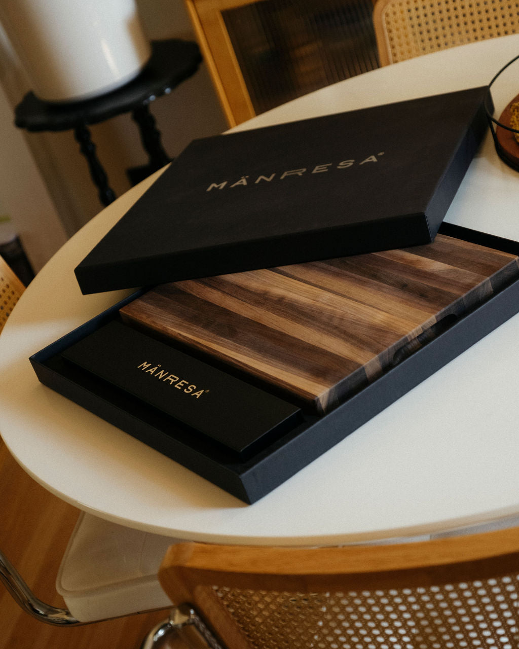 Walnut butcher block chef knife gift set, gift box lid propped on the tray over the board
